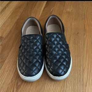 Black slip on sneakers
